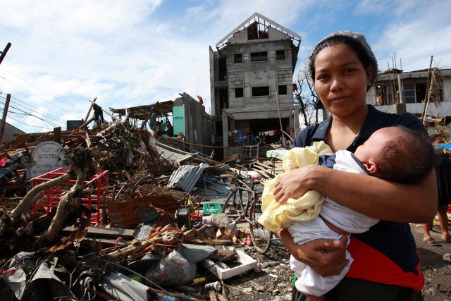 On 12 November, a woman cradling a baby stands amid deis and other destruction caused by Super Typhoon Haiyan, in Tacloban City  the area worst affected by the disaster  on the central island of Leyte. Water, sanitation and hygiene, food, medicine, shelter, deis clearance and communications are among the priority needs. Blocked roads have limited access and the delivery of relief supplies. On 12 November 2013 in the Philippines, Government-led emergency relief and recovery operations continue in the wake of the destruction caused by Super Typhoon Haiyan (known locally as Yolanda), which hit the central Philippines on 8 November. At least 2,500 people have been killed in the Category-5 storm; the death toll is expected to rise as more affected areas become accessible. Some 11.3 million people, including an estimated 4.7 million children, in nine regions across the country have been affected, and more than 673,000 people have been displaced. Most of them are sheltering in overcrowded evacuation centres. The storm, one of the most powerful ever recorded in the world, also destroyed homes, schools, hospitals, roads, communications and other basic infrastructure, and damaged power and water supply systems. As a result, access to the many areas remains limited, hampering humanitarian relief operations. In response to the emergency, UNICEF is rushing critical supplies to affected areas, including therapeutic food for children, health kits, and water and hygiene kits for up to 3,000 families. UNICEF is also airlifting US $1.3 million in additional relief supplies from its supply warehouse in Copenhagen for another 10,000 families, including those affected by the 7.2-magnitude earthquake that hit Bohol Province in mid-October. The shipments contain water purification tablets, soap, medical kits, tarpaulin sheets and micronutrient supplements. UNICEF is also supporting water and sanitation, education and child protection interventions for vulnerable children and