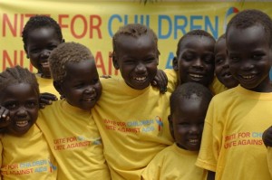 On 1 December 2005 in southern Sudan, children wearing 'Unite for Children, Unite Against AIDS' T-shirts attend a local launching of the global campaign of the same name in Juba, the capital of Bahr el Jebel State. The global campaign launch was held at United Nations Headquarters and in several world capitals on 25 October. Worldwide, 15 million children have lost one or both parents to AIDS. Every day, nearly 1,800 children under 15 become HIV-positive and 1,400 die from AIDS-related illness. More than 6,000 young people aged 15-24 acquire the virus daily. Yet children are missing from the global HIV/AIDS agenda.