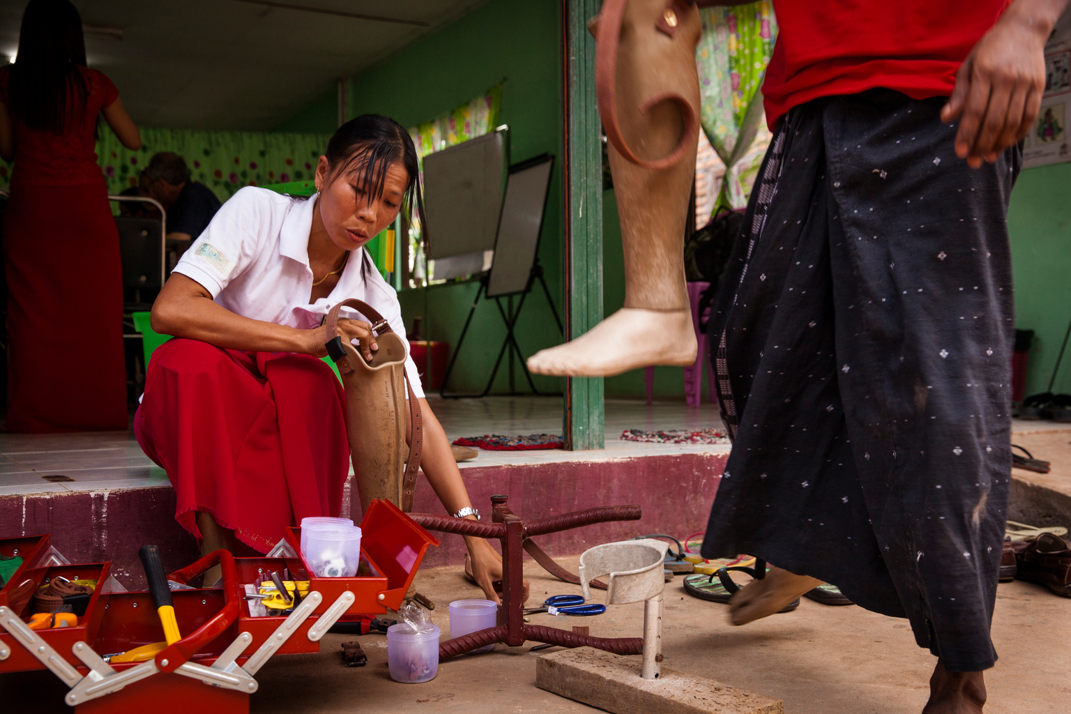 San San Maw, 33, (left) makes repairs to a prosthetic limb belonging to one of the centres customers at the Mine Victim Assistance Centre where she volunteers in Kawkareik, Kayin State, Myanmar, Sunday 2 April 2017. San San Maw is one of 30 volunteers working at the Centre. She lost her right leg when she trod on a landmine at the age of 13 while cutting bamboo on a mountain side. Here we do minor repairs and adjustments for people with prosthetic limbs, says Ms. Maw. But my main reason for volunteering is to give other victims encouragement in the same way I needed encouragement after my accident. According to Landmine Monitor, Myanmar has the third highest number of annual landmine casualties in the world, with an estimated 5 million residents currently living in areas clogged with the hidden weapons. In 2017, working with the Government of Myanmar, UNICEF will strive to meet the basic needs of the most vulnerable internally displaced children. Myanmar is experiencing three protracted humanitarian crises, each with its own set of complex underlying factors. In Rakhine State, inter-communal violence that erupted in 2012 continues to plague 120,000 internally displaced people spread across 40 camps or informal sites, as well as host communities. Eighty per cent of the displaced are women and children. In Kachin State, armed conflict that reignited in 2011 continues to impact communities caught in the crossfire between an ethnic armed group and the Myanmar army. Nearly 87,000 people remain displaced as a result, including 40 per cent who are in areas outside of government control. An additional 11,000 people remain displaced in northern Shan State, where a similar conflict oke out in 2011. Compounding the protracted crises are issues related to religious and/or ethnic discrimination, exploitation, chronic poverty, vulnerability to natural disasters, statelessness, trafficking and humanitarian access. In addition to the humanitarian crises in Rakhi